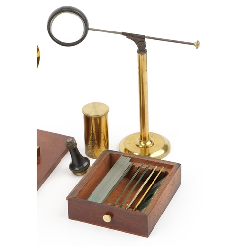 518 - A 19th century brass microscope with fitted case by W J Salmon, London, the case 21cm high.