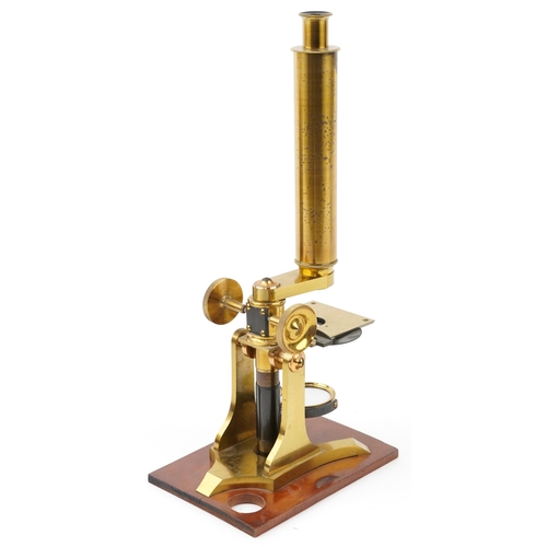 518 - A 19th century brass microscope with fitted case by W J Salmon, London, the case 21cm high.