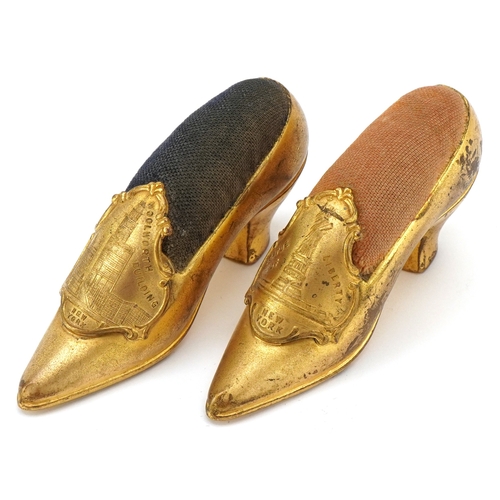69 - Two Grand Tour style New York souvenir pin cushions in the form of high heeled shoes, from The Woolw... 