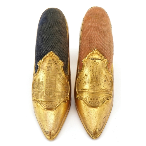 69 - Two Grand Tour style New York souvenir pin cushions in the form of high heeled shoes, from The Woolw... 