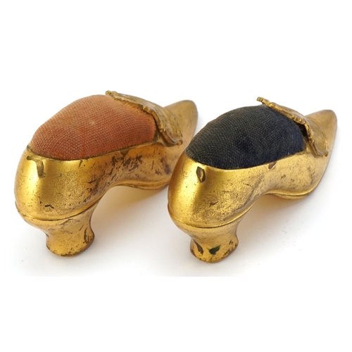 69 - Two Grand Tour style New York souvenir pin cushions in the form of high heeled shoes, from The Woolw... 