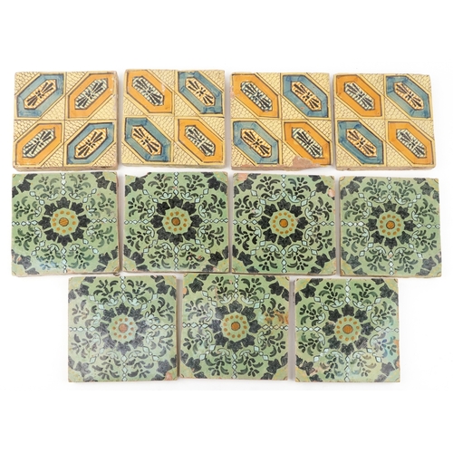 97 - Seven Moroccan hand painted pottery tiles and four similar tiles, 20cm x 20cm.