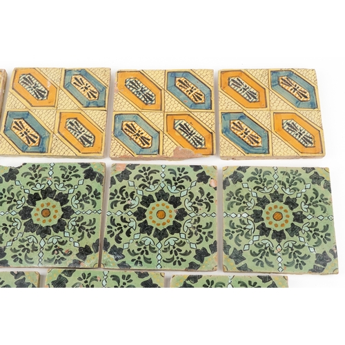 97 - Seven Moroccan hand painted pottery tiles and four similar tiles, 20cm x 20cm.