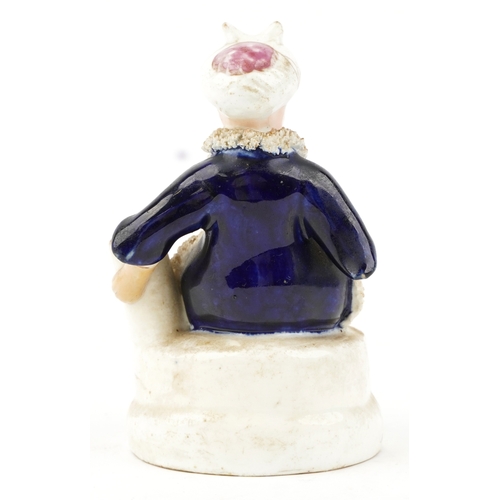 87 - A Victorian Staffordshire hand painted porcelain figure of a seated Sultan, 12.5cm high.