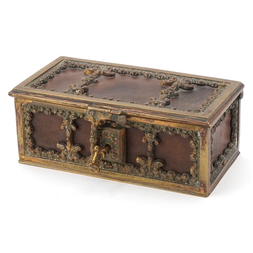 74 - An antique German leatherette jewellery casket with brass mounts, 17cm wide.