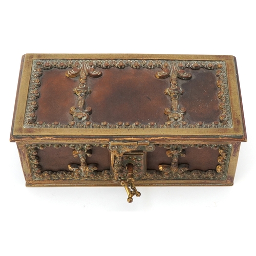 74 - An antique German leatherette jewellery casket with brass mounts, 17cm wide.