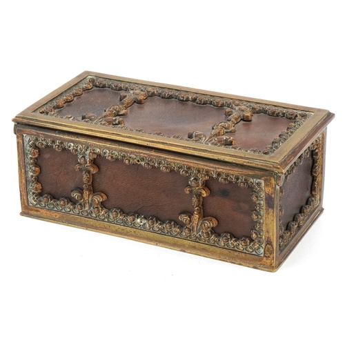 74 - An antique German leatherette jewellery casket with brass mounts, 17cm wide.