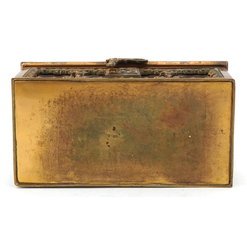 74 - An antique German leatherette jewellery casket with brass mounts, 17cm wide.