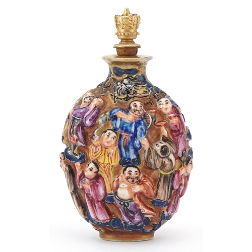 118 - A Chinese Canton porcelain scent bottle moulded in high relief with figures and hand painted in the ... 