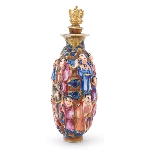 118 - A Chinese Canton porcelain scent bottle moulded in high relief with figures and hand painted in the ... 
