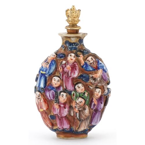 118 - A Chinese Canton porcelain scent bottle moulded in high relief with figures and hand painted in the ... 