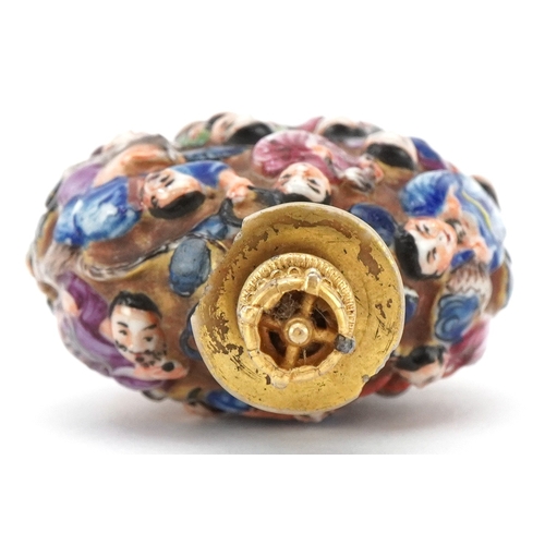 118 - A Chinese Canton porcelain scent bottle moulded in high relief with figures and hand painted in the ... 