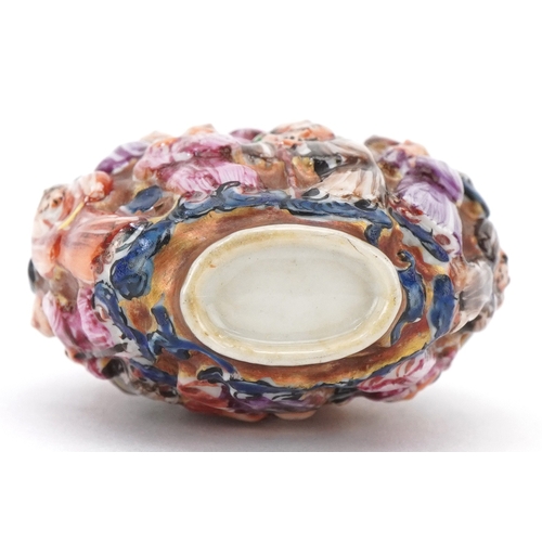 118 - A Chinese Canton porcelain scent bottle moulded in high relief with figures and hand painted in the ... 