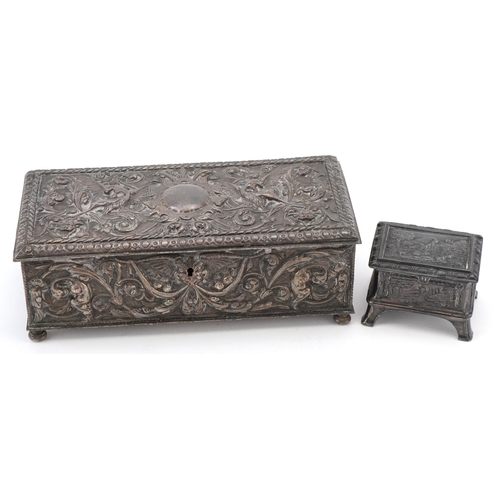 70 - Two antique silver plated jewellery caskets including a pewter example embossed with panels of sheph... 