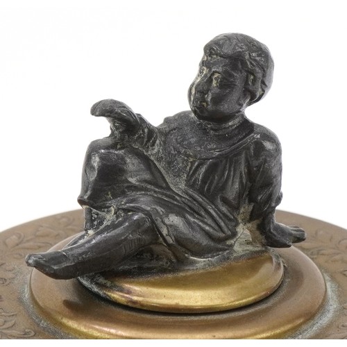 75 - A Grand Tour style brass moneybox with embossed neo-classical decoration and white metal mount in th... 