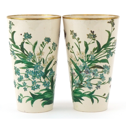 90 - A pair of Prattware beakers hand painted with foliage and butterflies, inscribed C & E Pratt, King's... 