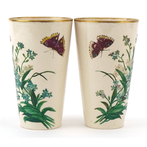 90 - A pair of Prattware beakers hand painted with foliage and butterflies, inscribed C & E Pratt, King's... 