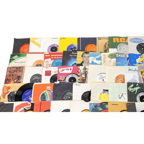 A collection of vinyl LP box sets and 45rpm records.