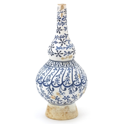 215 - An 18th century Turkish Ottoman Kutahya rosewater sprinkler decorated with stylized motifs, 18.5cm h... 