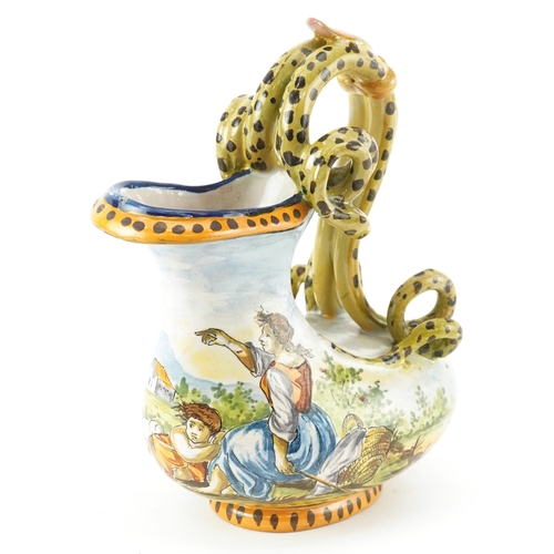 An Italian Albisola style Majolica jug with snake design handle, the body hand painted with a shepherd and flock of sheep, marks to the base, 19.5cm high.