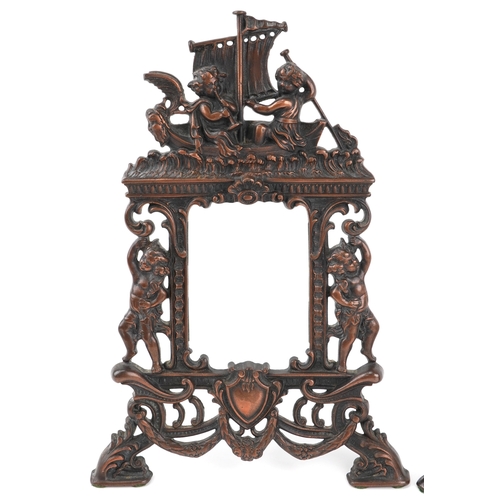 A pair of Art Nouveau cast iron photo frames embossed with Putti, each ...