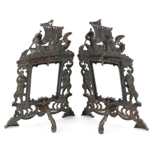 A pair of Art Nouveau cast iron photo frames embossed with Putti, each ...