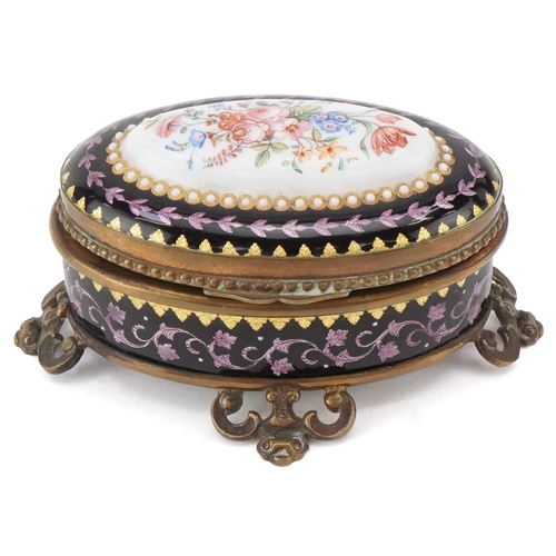 51 - A 19th century guilloche enamel jewellery casket with hand painted floral decoration and brass mount... 
