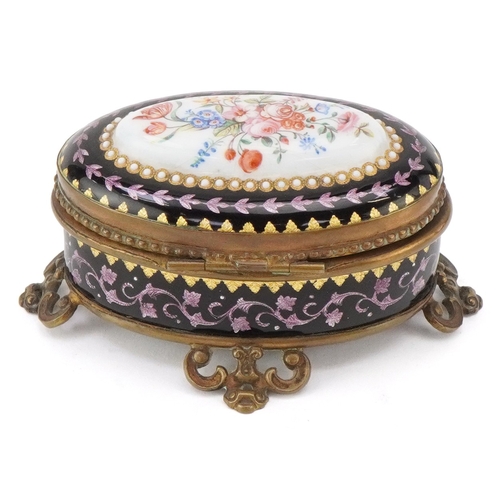51 - A 19th century guilloche enamel jewellery casket with hand painted floral decoration and brass mount... 