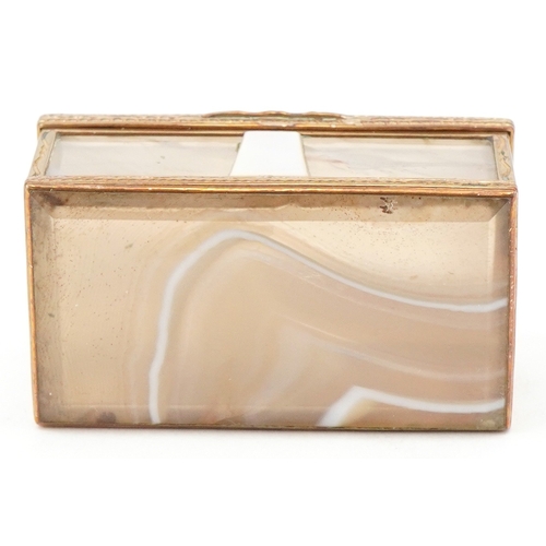 53 - An early 20th century agate and mother of pearl trinket box with gilt metal mounts, 5.2cm wide.
