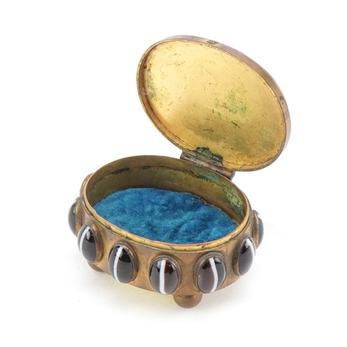 52 - A late 19th century brass jewellery casket set with Scottish agate cabochons, the hinged lid reveali... 