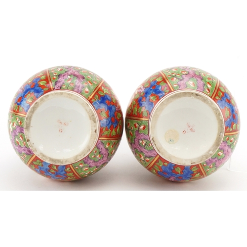 40 - A pair of late 18th/early 19th century Derby porcelain bottleneck vases with covers, each with hand ... 