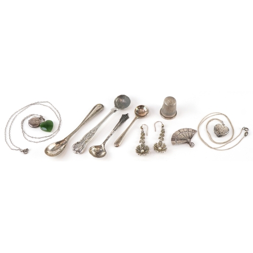 Silver and white metal objects including mustard spoons, thimble and ...