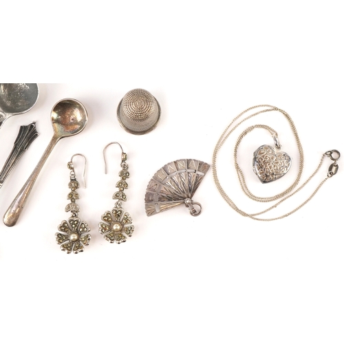 Silver and white metal objects including mustard spoons, thimble and ...