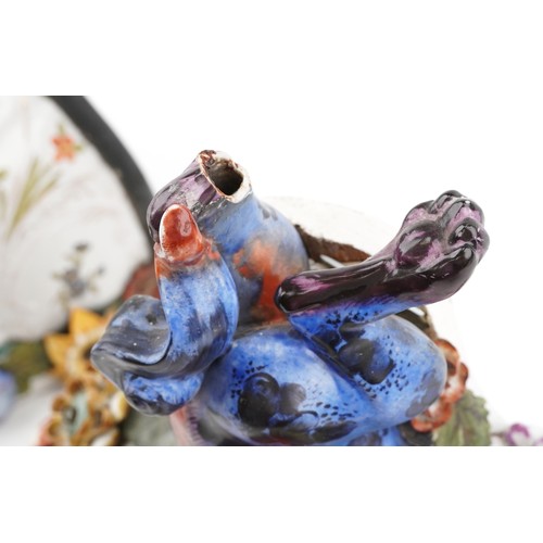 226 - A pair of Continental porcelain wall brackets with Chinese dogs of Foo supports hand painted with co... 