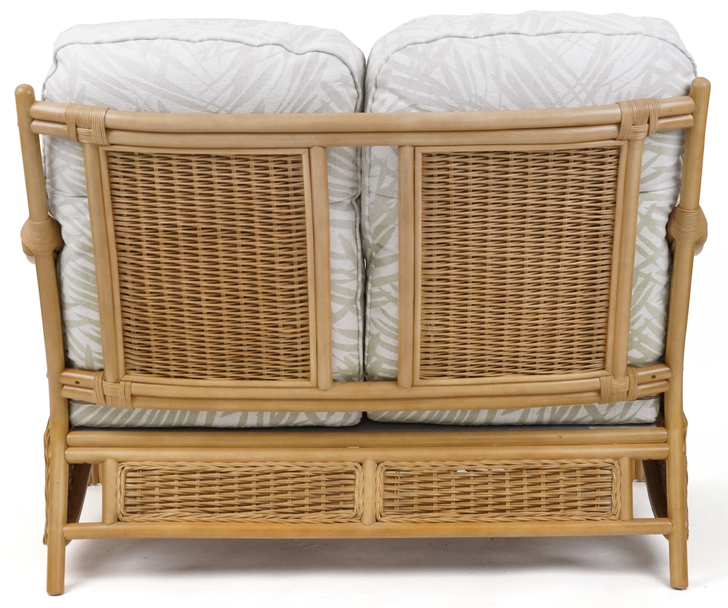 A modern wicker and bent wood conservatory two seat settee with ...