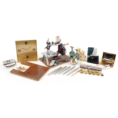 Objects including a looping brass mantle clock, musical compact ...