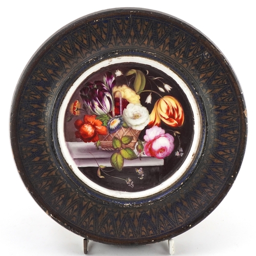 35 - A 19th century porcelain plaque possibly Sèvres, hand painted with flowers, housed in a giltwood fra... 