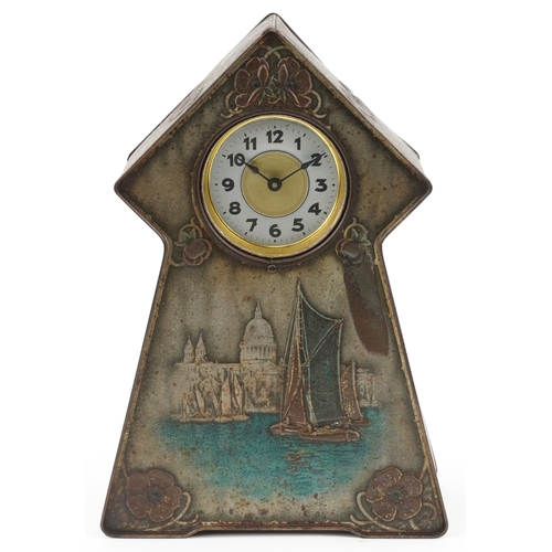 14 - An Art Nouveau Victory V tin mantle clock advertising Fryer & Co., embossed with stylized flowers an... 