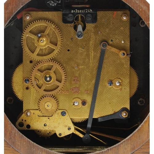 19 - Junghans, an Art Deco inlaid mahogany Westminster chiming mantle clock, 56cm wide.