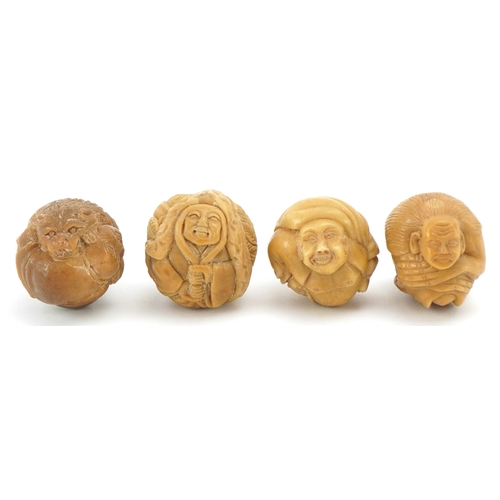 Four Japanese carved vegetable ivory netsukes of Buddhas, the largest ...