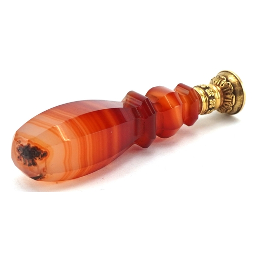 47 - A Victorian faceted agate and gold mounted desk seal with an unengraved bloodstone matrix, housed in... 