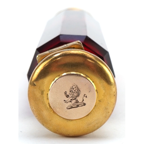 44 - A Victorian double ended faceted ruby glass scent bottle with silver gilt mounts, retailed by Baxter... 