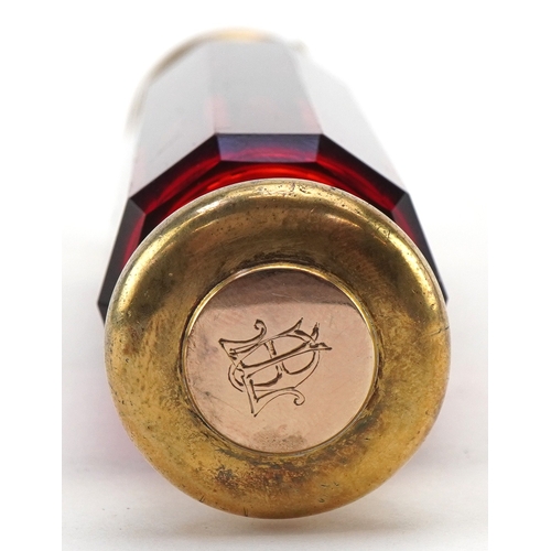 44 - A Victorian double ended faceted ruby glass scent bottle with silver gilt mounts, retailed by Baxter... 