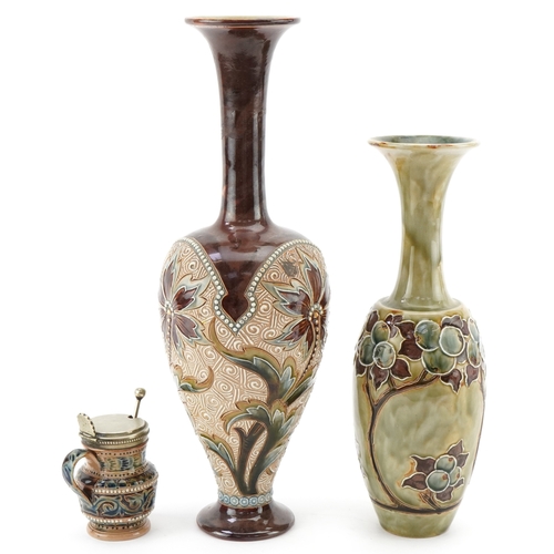 60 - Eliza Simmance for Doulton Lambeth, two Art Nouveau stoneware bottleneck vases and a mustard, the la... 
