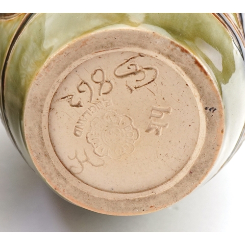 60 - Eliza Simmance for Doulton Lambeth, two Art Nouveau stoneware bottleneck vases and a mustard, the la... 