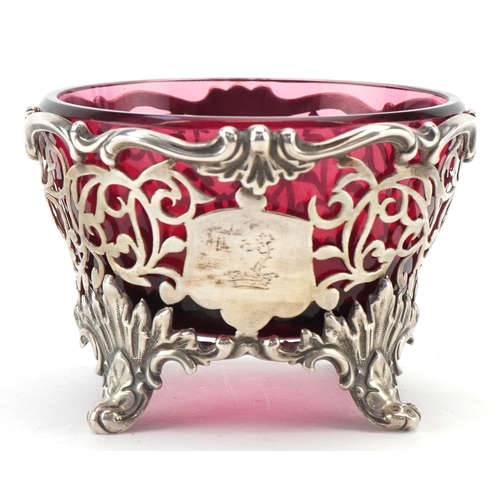 A Victorian pierced silver open table salt raised on four feet having a ...