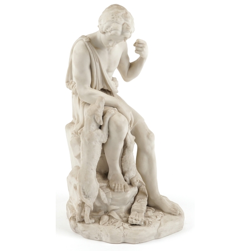 23 - A Victorian parian study of a seated hunter with a hound, 38cm high.