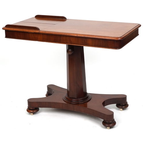 A Victorian mahogany adjustable reading table, the rectangular top ...