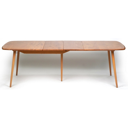 An Ercol elm and beech rectangular extending dining table, 72cm H x ...