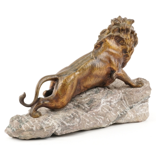 7 - Robert Bousquet (1894-1917) - A French gilt patinated bronze roaring lion mounted on a stone base, s... 